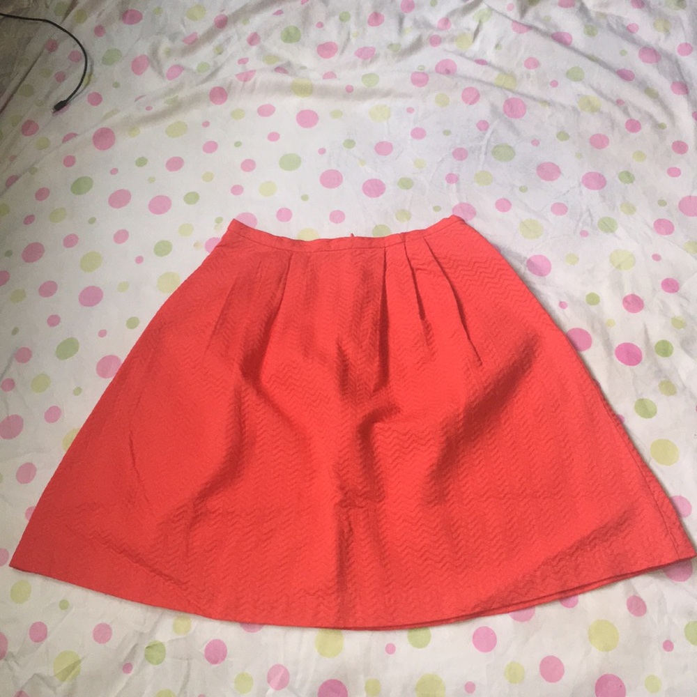 Orange pleated skirt
